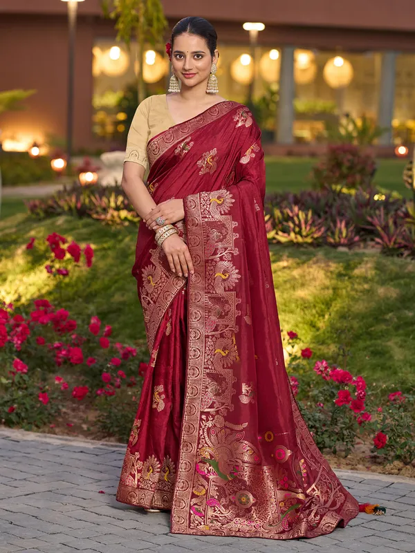 Red dola silk saree with zari stone weaving