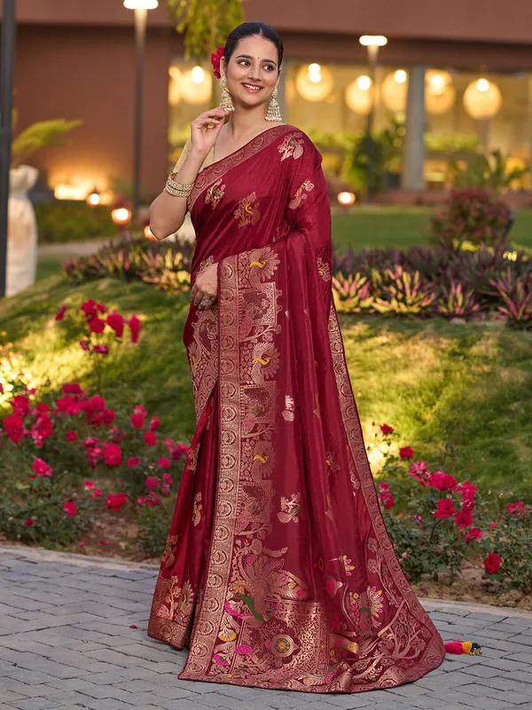 Red dola silk saree with zari stone weaving