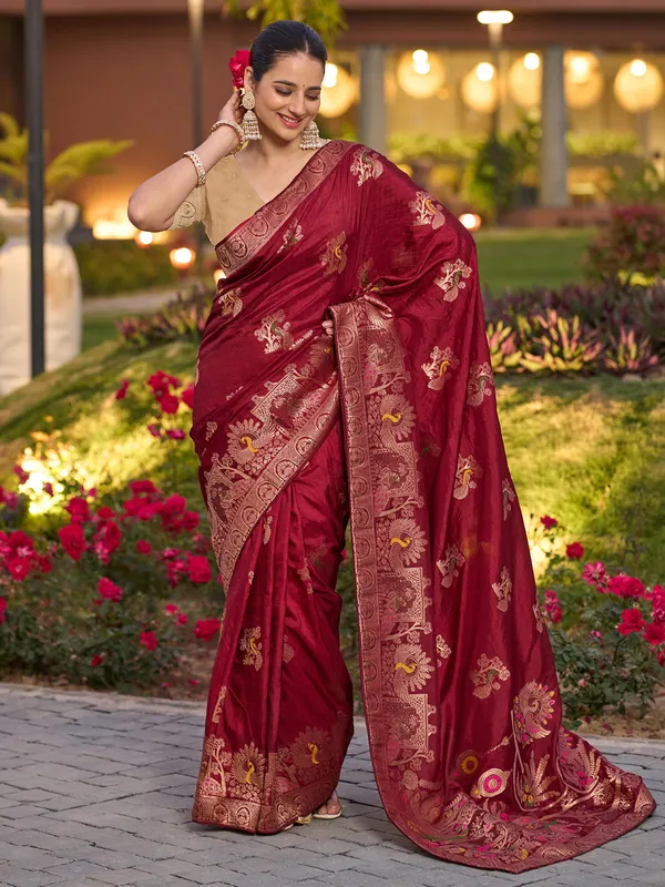 Red dola silk saree with zari stone weaving
