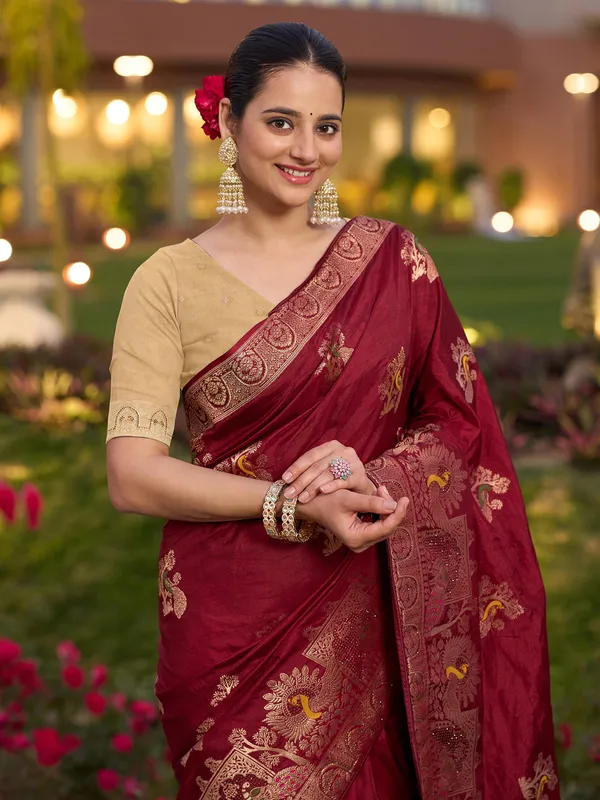 Red dola silk saree with zari stone weaving