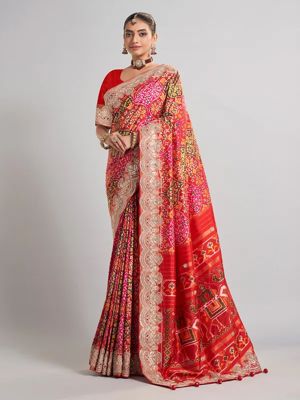 Red hyderabadi patola silk saree with a royal bridal look