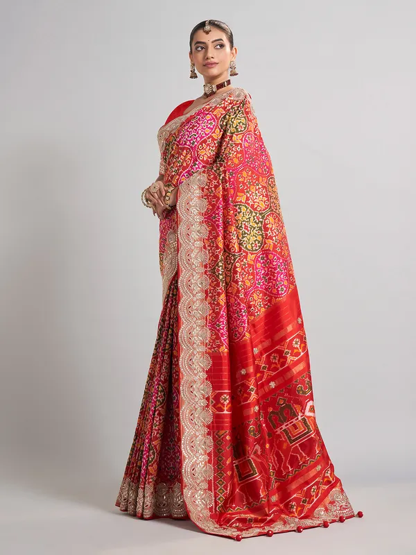 Red hyderabadi patola silk saree with a royal bridal look
