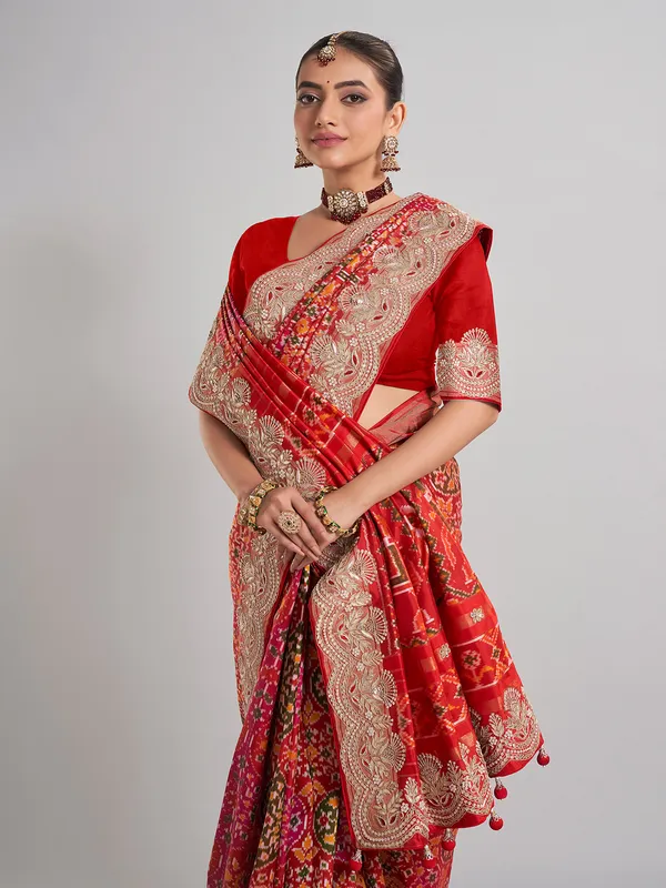 Red hyderabadi patola silk saree with a royal bridal look
