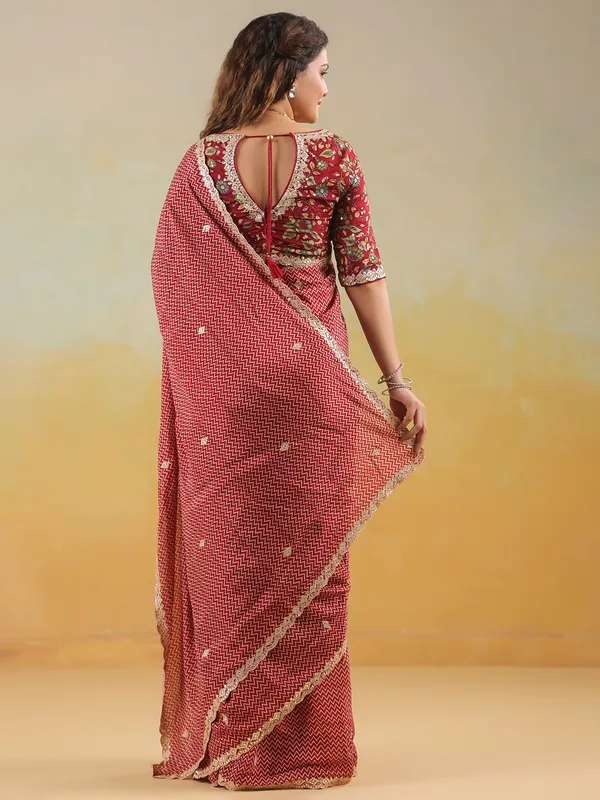 Red muslin printed saree with ready made blouse