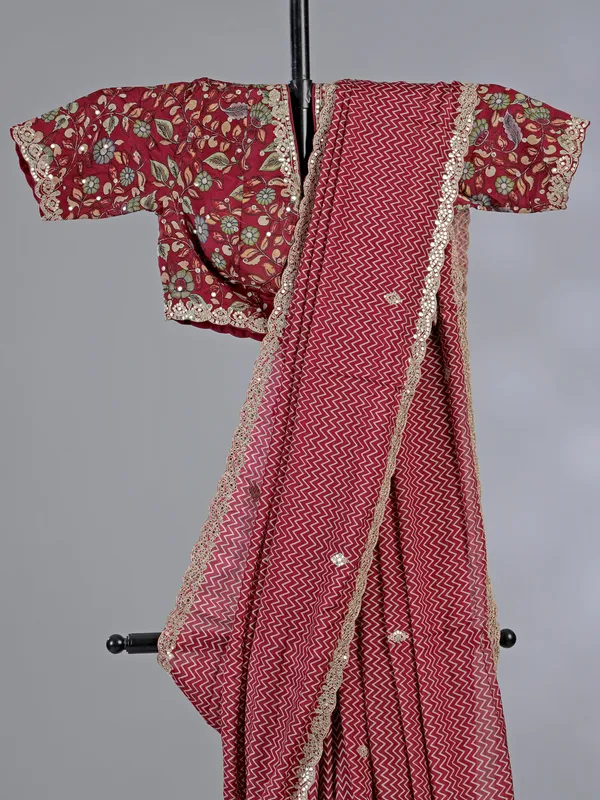 Red muslin silk printed saree with gota accents