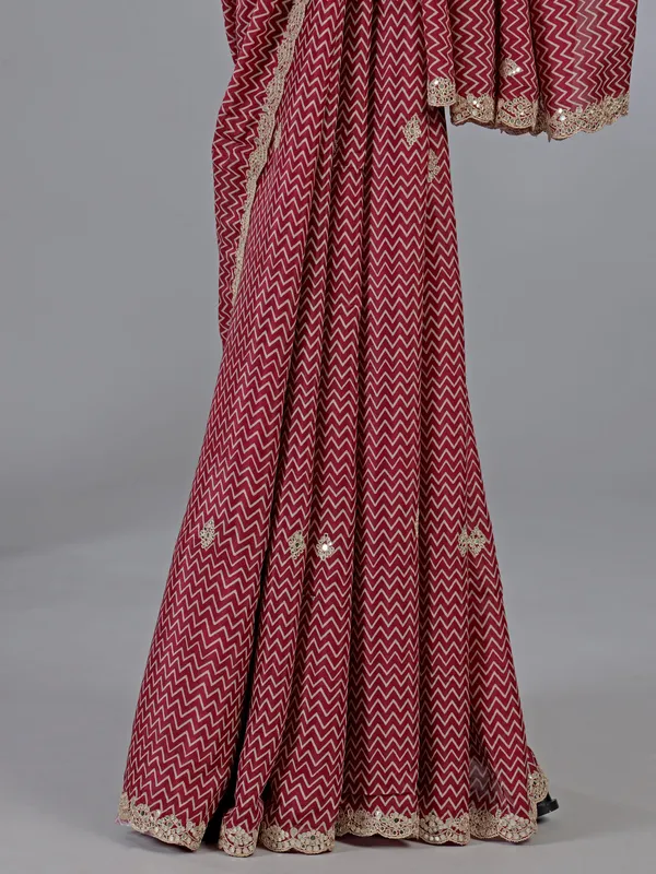 Red muslin silk printed saree with gota accents
