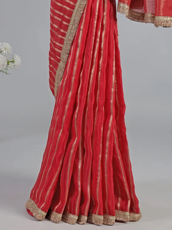 Red organza saree with traditional highlights