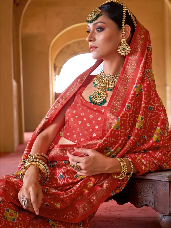 Red printed patola silk saree with unstitched blouse
