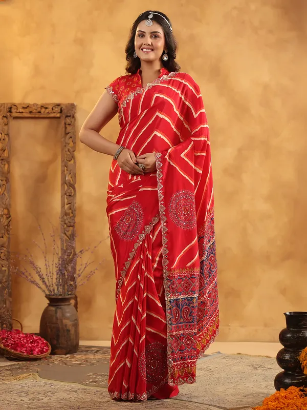 Red printed silk saree with aabla and resham work