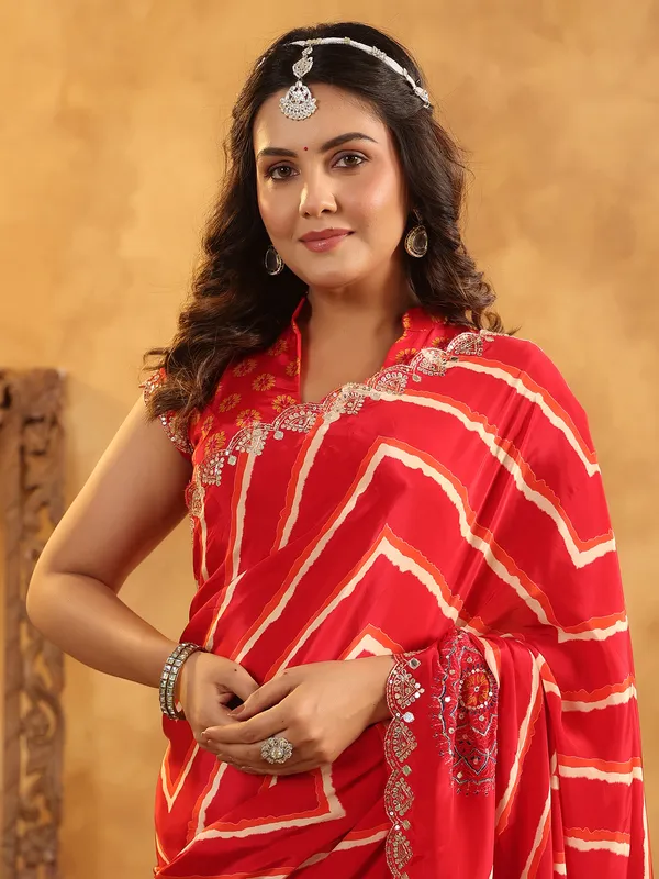 Red printed silk saree with aabla and resham work