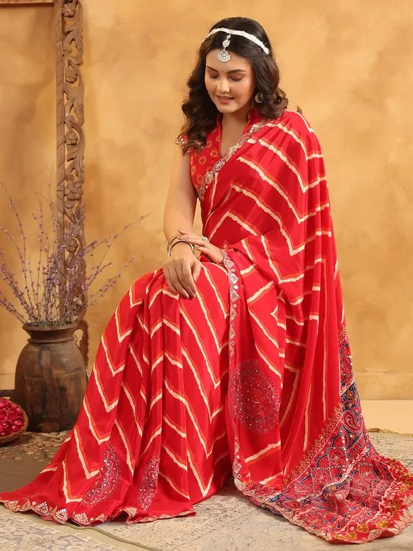 Red printed silk saree with aabla and resham work