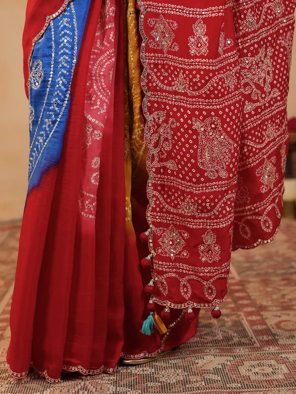 Red printed silk saree with aabla embellishment