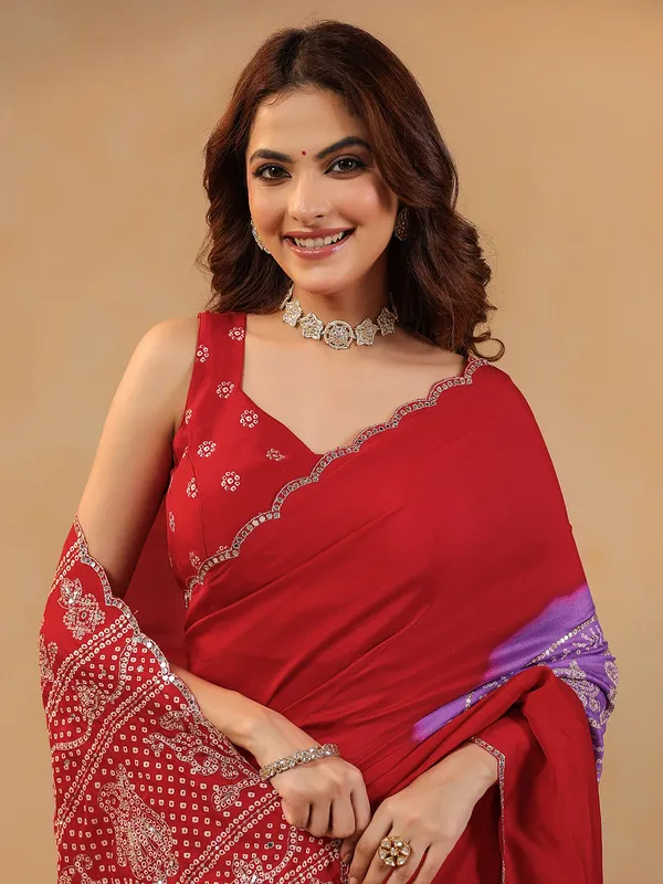 Red printed silk saree with aabla embellishment