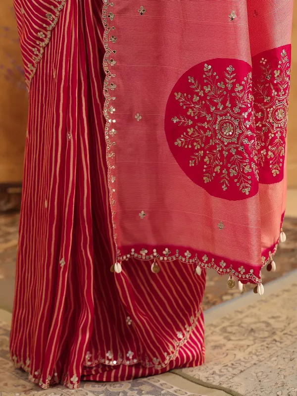 Red printed silk saree with resham and cutdana work