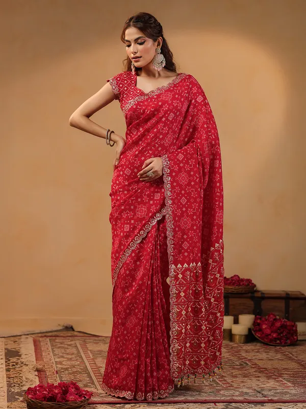 Red printed silk saree with resham embellishment