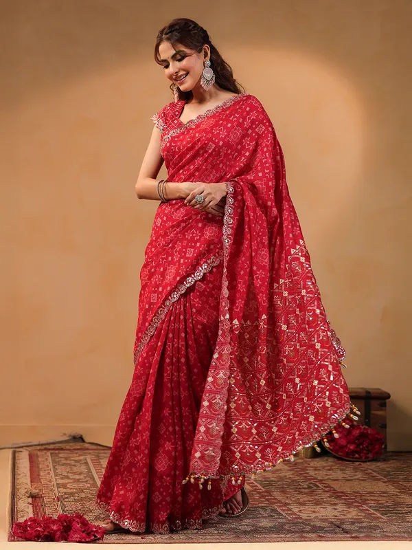 Red printed silk saree with resham embellishment