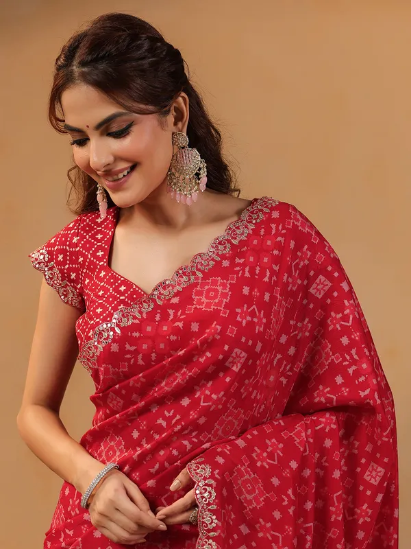 Red printed silk saree with resham embellishment