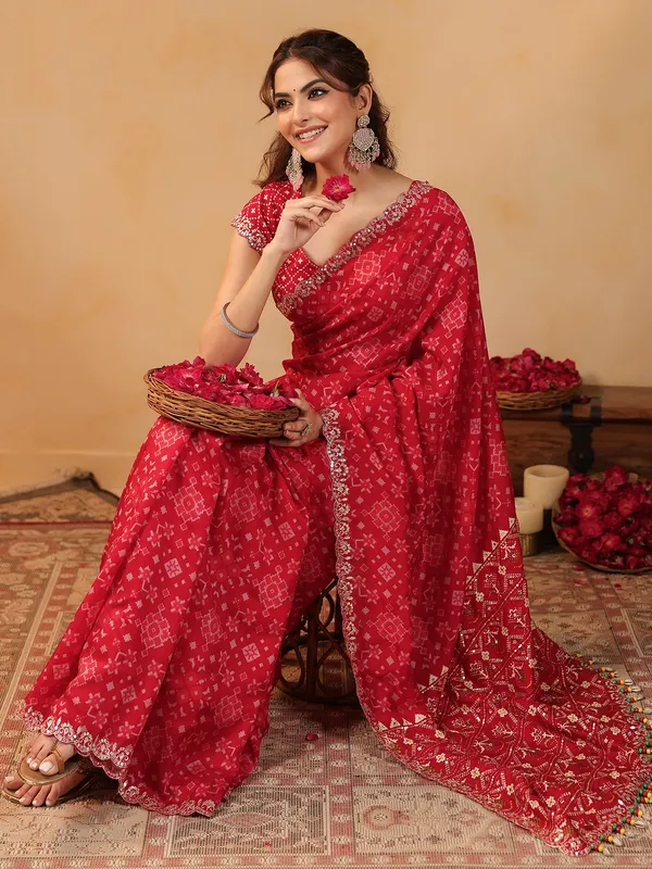 Red printed silk saree with resham embellishment