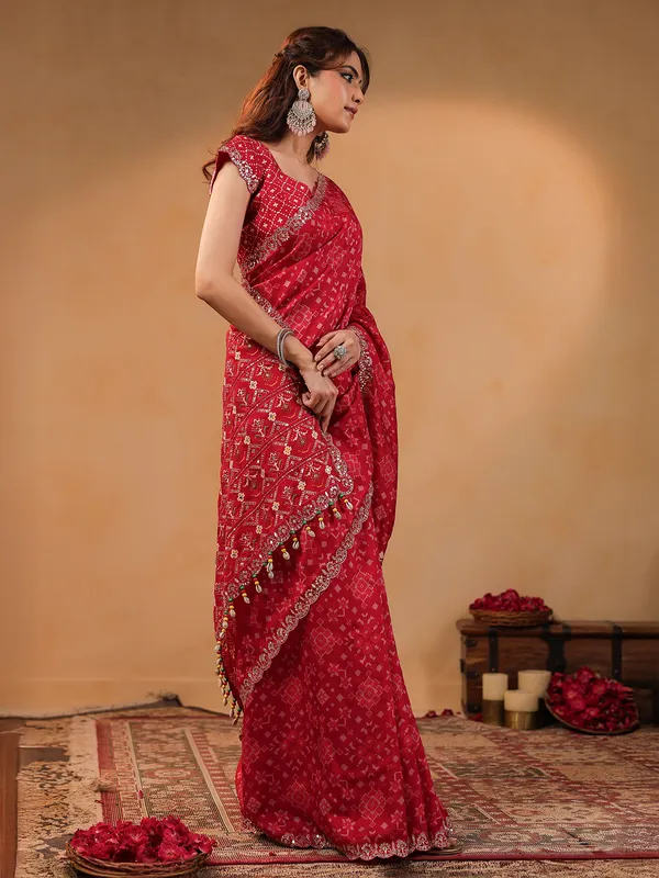 Red printed silk saree with resham embellishment