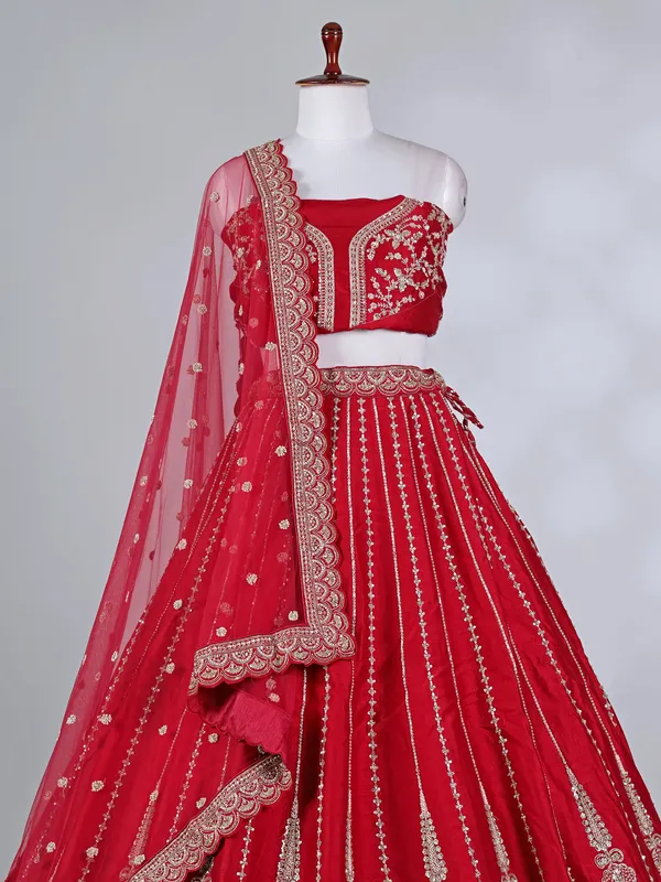 Red raw silk bridal lehenga choli with cutdana detailing