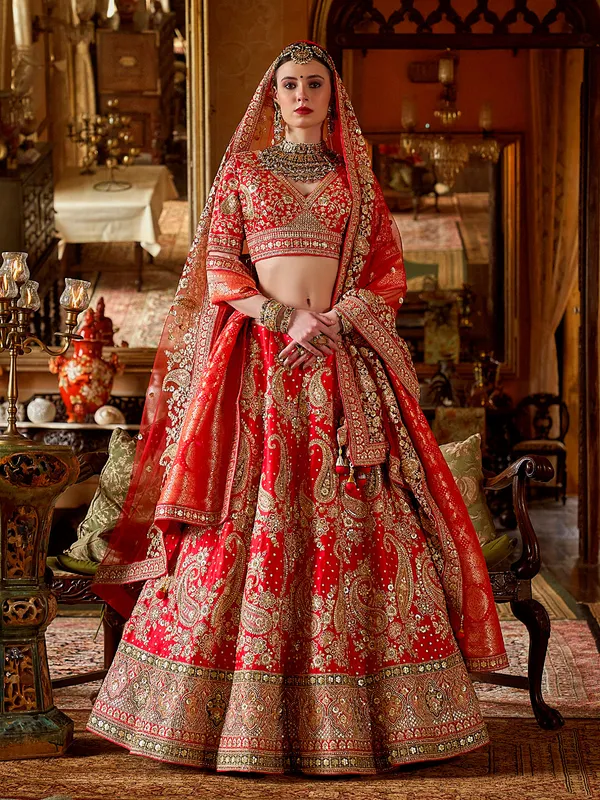 Red silk bridal lehenga choli with rich resham emberoidrey