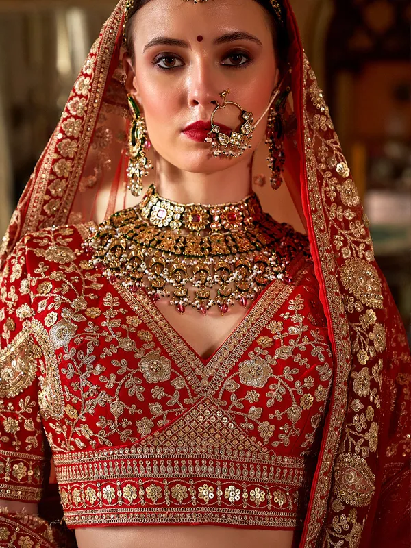 Red silk bridal lehenga choli with rich resham emberoidrey