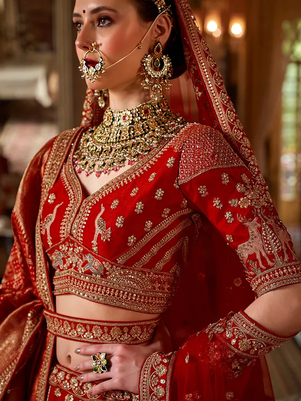 Red silk bridal lehenga choli with with beads and resham work