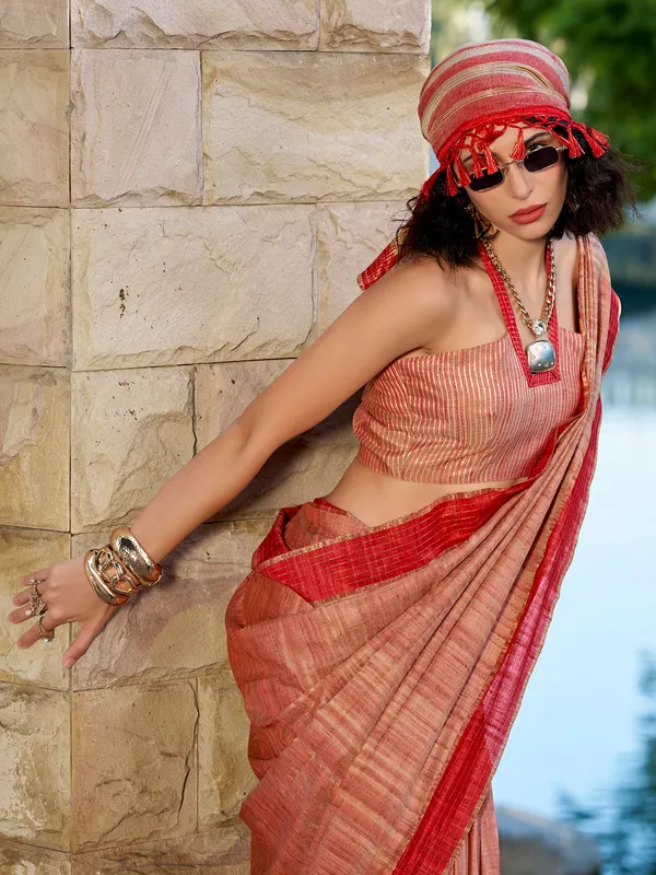 Red silk saree adorned with zari work