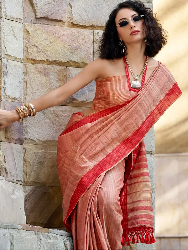 Red silk saree adorned with zari work