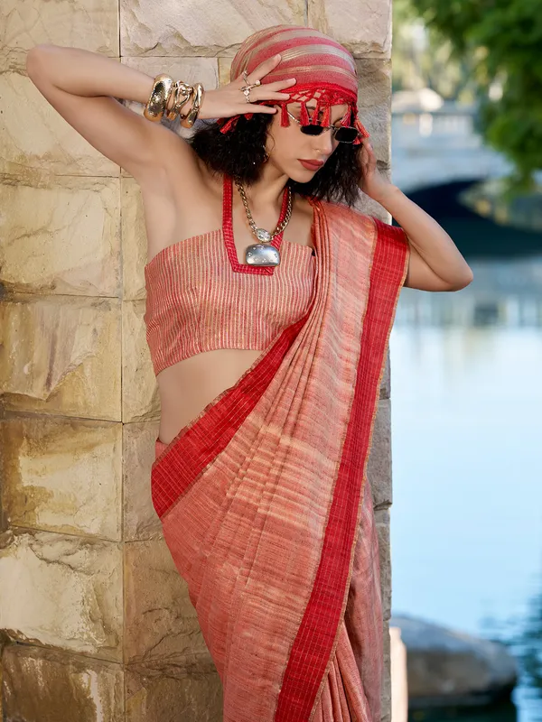 Red silk saree adorned with zari work