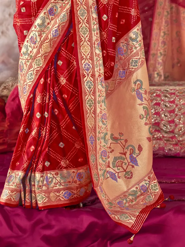 Red silk saree featuring luxe zari and print