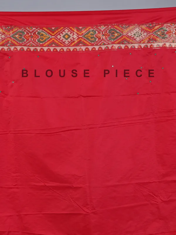 Red silk saree with colorful motifs