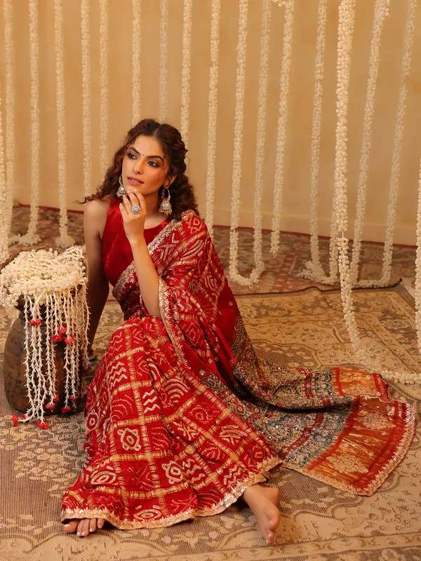 Red wedding wear bandhej silk saree with print