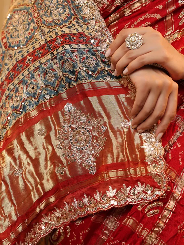 Red wedding wear bandhej silk saree with print