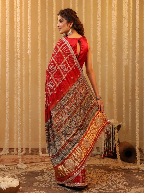 Red wedding wear bandhej silk saree with print