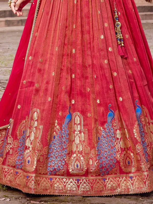 Red wedding wear silk lehenga choli with zari glow