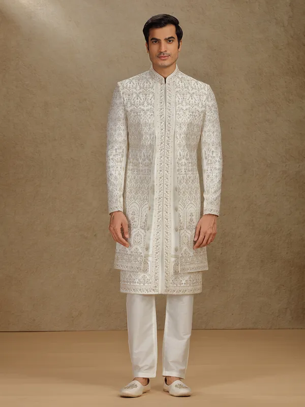 Regal cream silk sherwani with embroidery accents