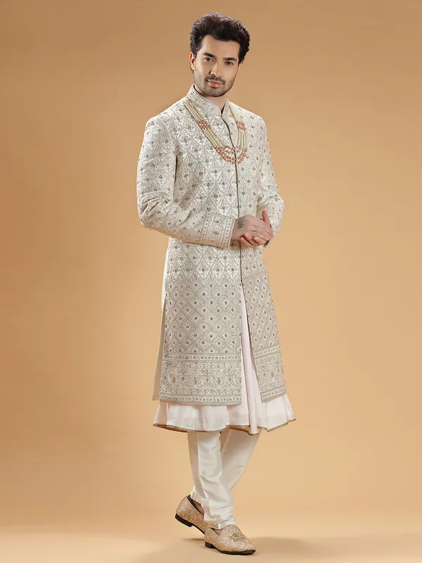 Rich raw silk cream hue groom sherwani