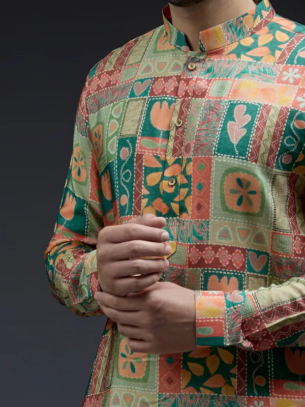 Rich silk green kurta suit in unique ethnic print