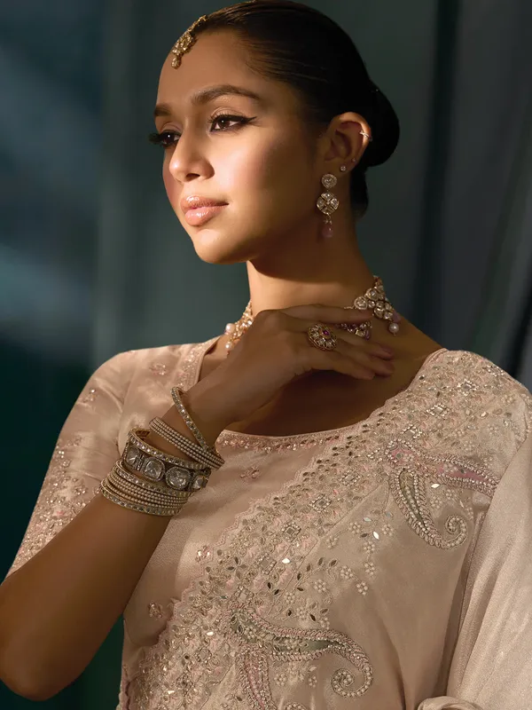 Rose gold silk festive wear saree with mirror worm