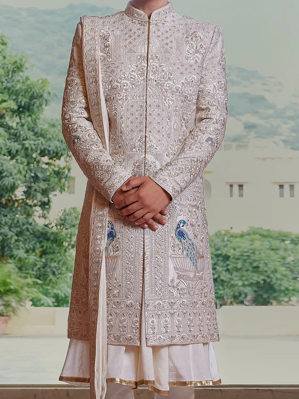 Royal cream peshwai style sherwani with resahm work