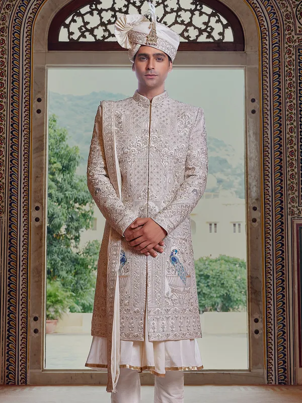 Royal cream peshwai style sherwani with resahm work