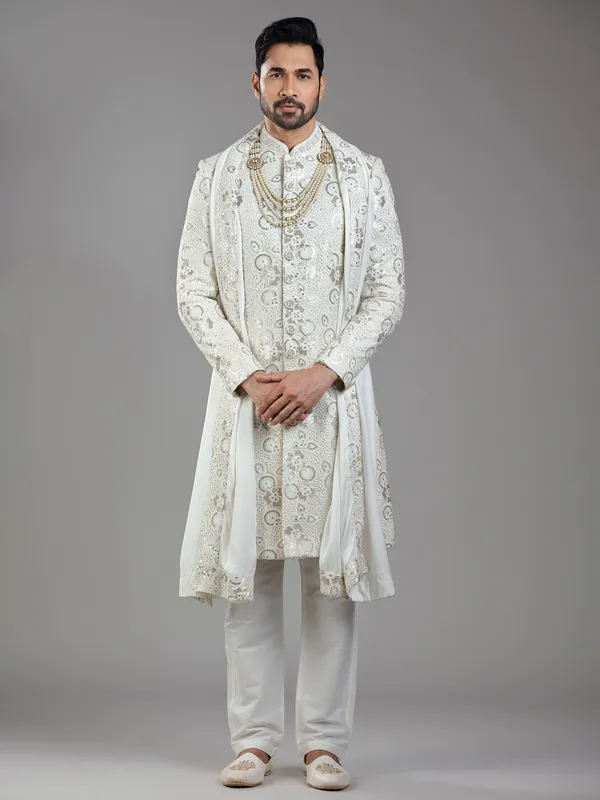 Royal splendor in cream silk with intricate embellishments and rich detailing