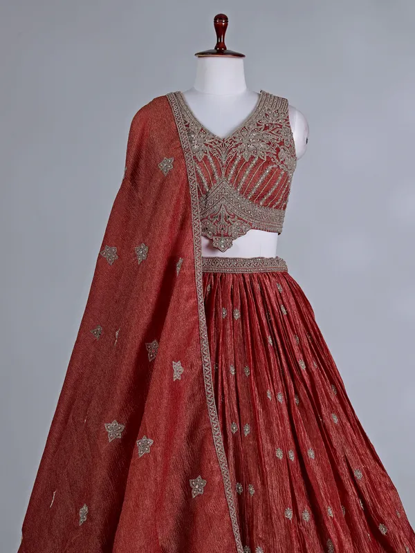 Rust orange silk wedding lehenga choli with stones work