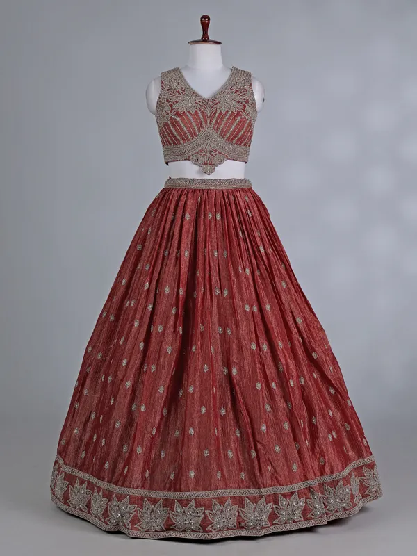 Rust orange silk wedding lehenga choli with stones work