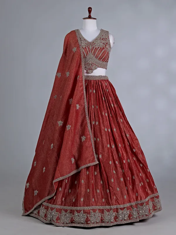 Rust orange silk wedding lehenga choli with stones work