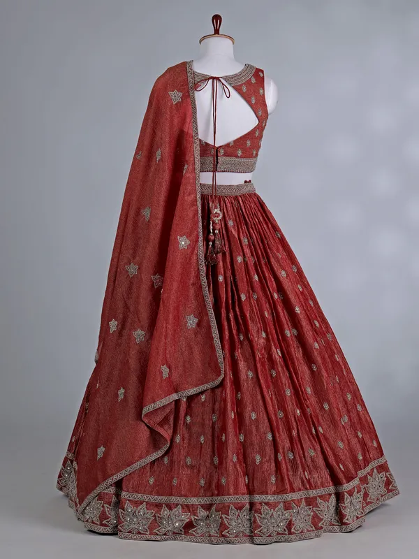 Rust orange silk wedding lehenga choli with stones work