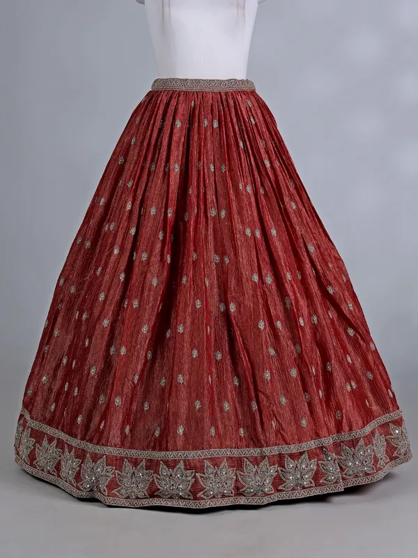 Rust orange silk wedding lehenga choli with stones work