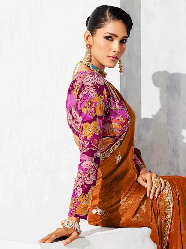 Rust orange tissue silk saree accented with resham work