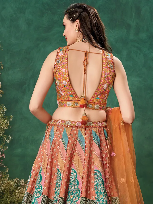 Rust orange wedding wear raw silk lehenga choli